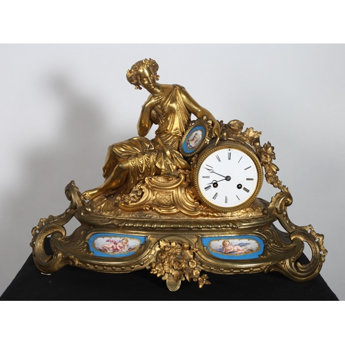 104 - A 19TH CENTURY GILT METAL AND PORCELAIN MANTEL CLOCK by Miroy Freres Paris the circular drum with en... 