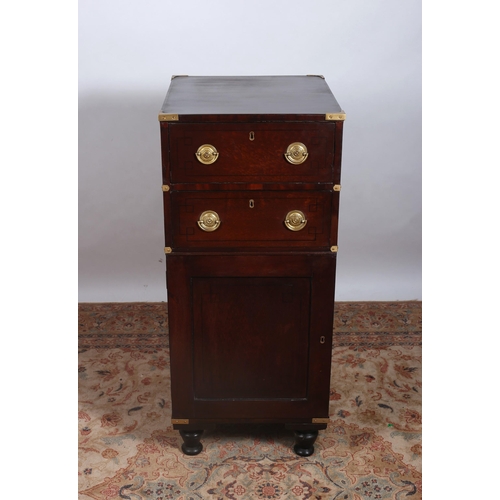 228 - A 19TH CENTURY MAHOGANY AND BRASS BOUND MILITARY CHEST of rectangular outline the shaped top above t... 