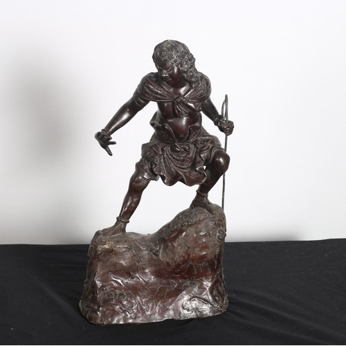 372 - A 19TH CENTURY BRONZE FIGURE modelled as a Chinese warrior in traditional dress shown standing on a ... 