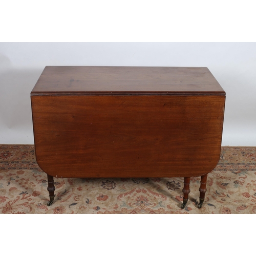 535 - A GEORGIAN MAHOGANY DROP LEAF TABLE the rectangular hinged top above a frieze drawer on ring turned ... 