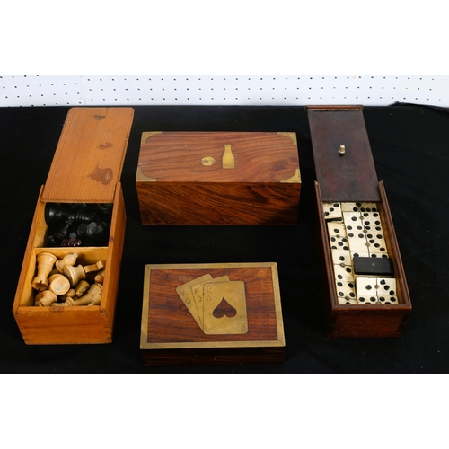 547 - A COLLECTION OF GAMES IN BOXES to include dominos, chess men, playing cards, table bowls (4)