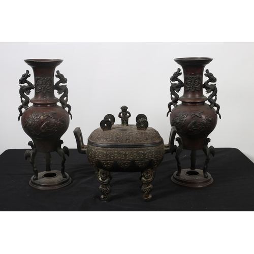 110 - A PAIR OF JAPANESE BRONZE VASES each of baluster form moulded in relief with birds and foliage with ... 