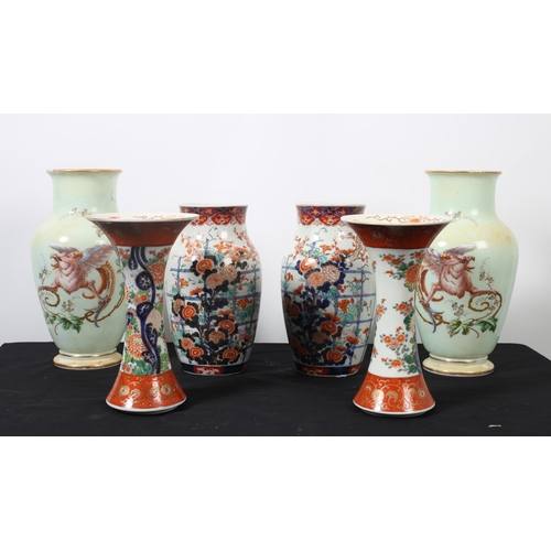 114 - A PAIR OF IMARI DESIGN VASES each of baluster form the white ground with floral decoration A PAIR OF... 