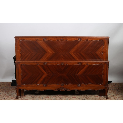 139 - A PAIR OF VINTAGE MAHOGANY BED ENDS the rectangular headboard with foliate and flowerhead carving wi... 