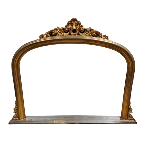 145 - A VICTORIAN DESIGN GILT FRAME OVERMANTEL MIRROR the rectangular arched plate within a moulded frame ... 