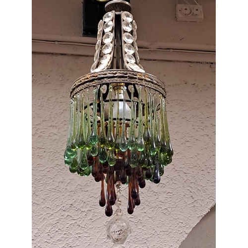 173 - A CONTINENTAL GILT BRASS AND COLOURED GLASS CENTRE LIGHT hung with cascading drops 
67cm drop