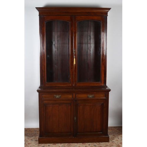 177 - AN EDWARDIAN MAHOGANY LIBRARY BOOKCASE the outset moulded cornice above a pair of glazed doors conta... 