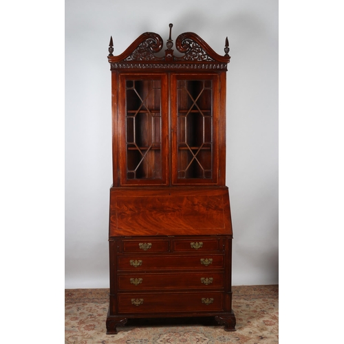 178 - A GEORGIAN DESIGN MAHOGANY AND SATINWOOD INLAID BUREAU BOOKCASE the pierced swan neck cornice above ... 