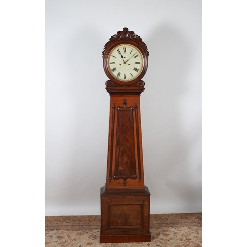 180 - A 19TH CENTURY MAHOGANY LONG CASED CLOCK the circular hood with carved scroll cresting with painted ... 