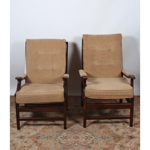 184 - A PAIR OF VINTAGE MAHOGANY AND UPHOLSTERED ARMCHAIRS each with a buttoned upholstered back and seat ... 