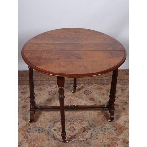 186 - A 19TH CENTURY BURR WALNUT SUTHERLAND TABLE of oval outline the shaped top raised on dual ring turne... 