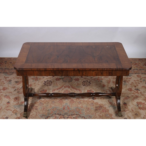 187 - A REGENCY DESIGN ROSEWOOD CROSSBANDED COFFEE TABLE of rectangular outline the shaped top raised on l... 