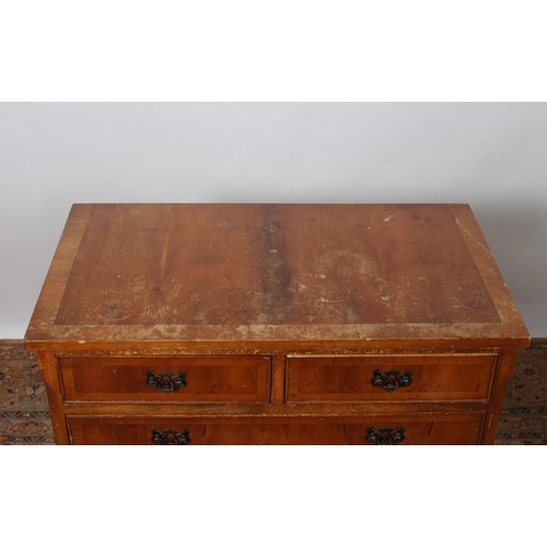 193 - A YEW WOOD CROSSBANDED CHEST of rectangular outline the shaped top above two short and three long gr... 