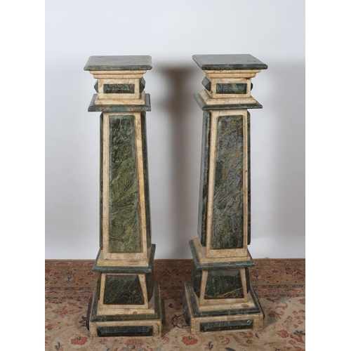 200 - A PAIR OF TWO COLOURED VEINED MARBLE PEDESTALS each with a square top above a spreading column with ... 