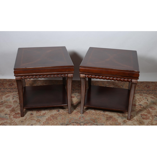 218 - A PAIR OF REGENCY DESIGN MAHOGANY LAMP TABLES each of rectangular form the shaped top's raised on re... 