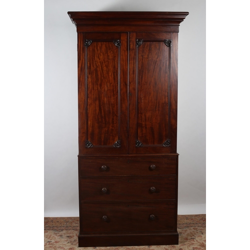 241 - A 19TH CENTURY MAHOGANY WARDROBE the moulded cornice above a pair of panel doors with foliate carvin... 