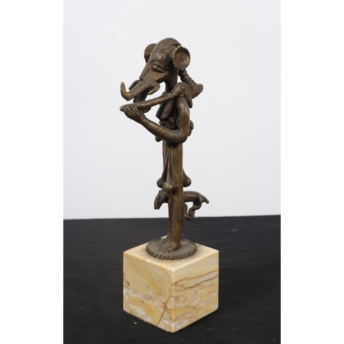 258 - TRIBAL ART 
A bronze sculpture modelled as a grotesque figure shown standing on an onyx base
30cm (h... 