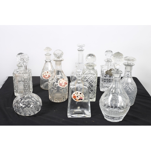 270 - A COLLECTION OF CUT GLASS AND MOULDED GLASS DECANTERS with stoppers together with three Mason's Iron... 