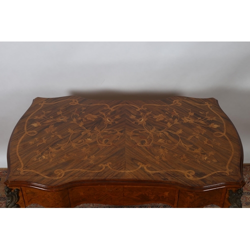 28 - A CONTINENTAL KINGWOOD MARQUETRY AND GILT BRASS MOUNTED OCCASIONAL TABLE of serpentine outline the s... 