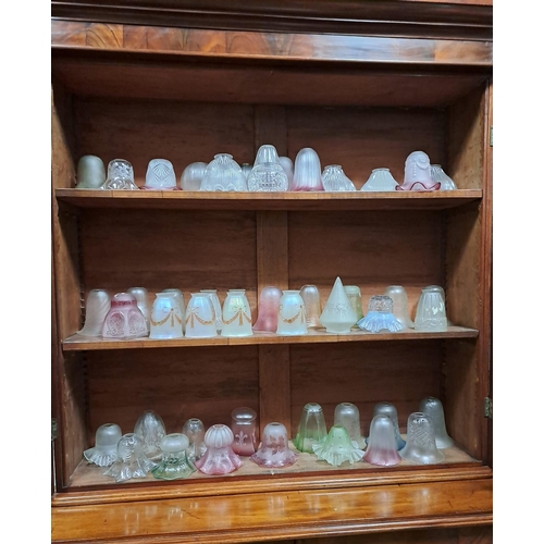 283 - A LARGE COLLECTION OF VINTAGE FROSTED GLASS AND COLOURED GLASS AND CLEAR GLASS SHADES on three shelv... 