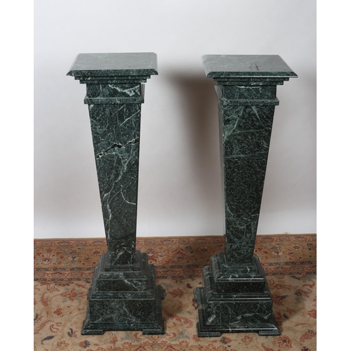 325 - A PAIR OF GREEN VEINED MARBLE PEDESTALS each with a square top above a square tapering column on ste... 