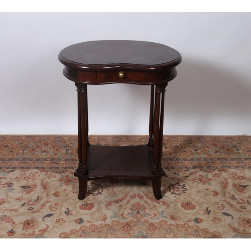 328 - A MAHOGANY KIDNEY SHAPED OCCASIONAL TABLE the shaped top with frieze drawer raised on cylindrical ri... 