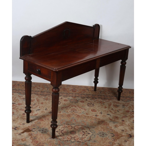 338 - A VICTORIAN MAHOGANY SIDE TABLE of rectangular outline the shaped top with moulded gallery above a m... 