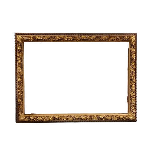 384 - A CONTINENTAL GILT FRAME MIRROR the rectangular plate within an acorn leaf frame with scroll decorat... 