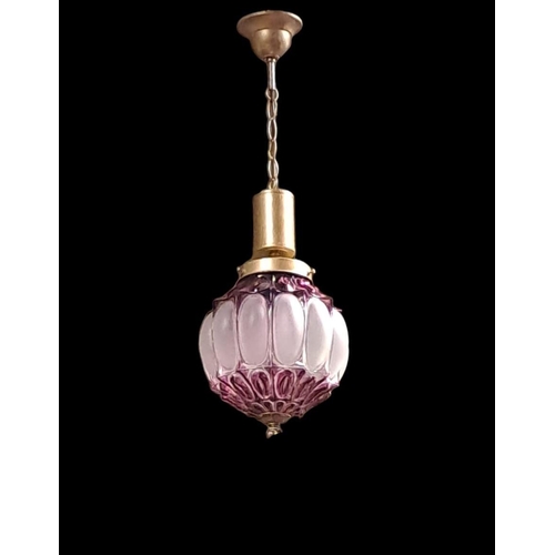 395 - A RUBY GLASS FROSTED GLASS AND BRASS CENTRE LIGHT of bulbous form with link chain suspension 
70cm d... 