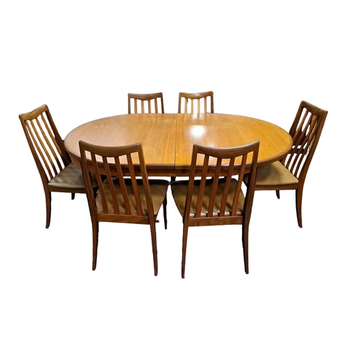 397 - A VINTAGE TEAK EIGHT PIECE G-PLAN DINING ROOM SUITE comprising six dining chairs the curved top rail... 