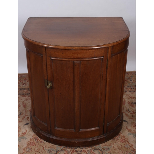 404 - A VINTAGE MAHOGANY SIDE CABINET of demi lune outline the shaped top above a cupboard with moulded pa... 