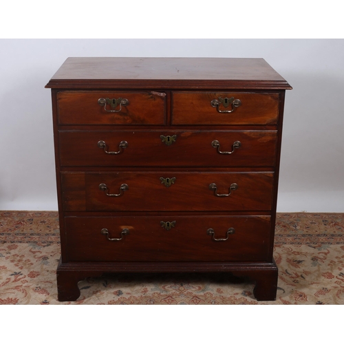 405 - A GEORGIAN MAHOGANY CHEST of rectangular outline the shaped top above two short and three long gradu... 