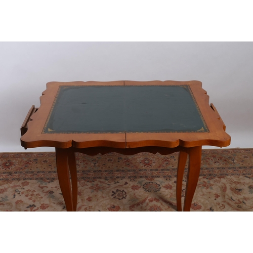 407 - A CONTINENTAL SATIN BIRCH FOLDOVER CARD TABLE the serpentine hinged top with chess board containing ... 