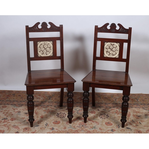 419 - A PAIR OF VINTAGE MAHOGANY HALL CHAIRS each with an architectural top rail above a tiled panel splat... 