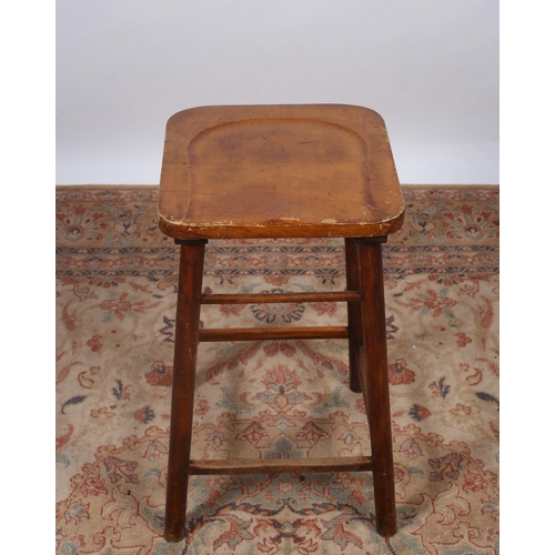 421 - A VINTAGE HARDWOOD HIGH STOOL the shaped seat raised on cylindrical legs joined by cross stretchers ... 