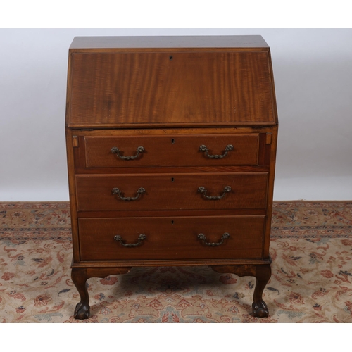 425 - A VINTAGE MAHOGANY BUREAU the hinged writing slope containing pigeon holes and drawers above three l... 