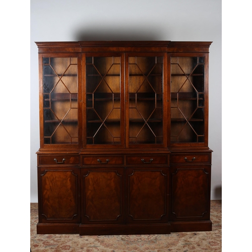 428 - A GEORGIAN STYLE MAHOGANY BREAKFRONT LIBRARY BOOKCASE the moulded cornice above four astragal glazed... 