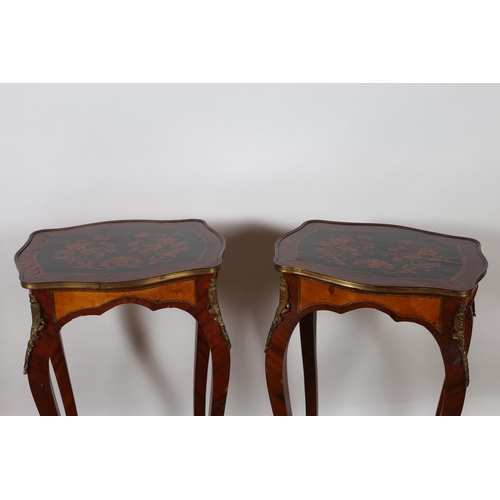 429 - A PAIR OF CONTINENTAL KINGWOOD MARQUETRY AND GILT BRASS MOUNTED TABLES each of serpentine outline th... 