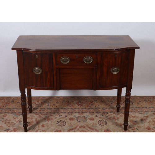 446 - A 19TH CENTURY MAHOGANY SIDEBOARD of rectangular bowed outline the shaped top above three frieze dra... 