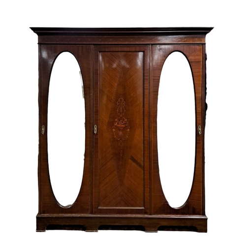 452 - AN EDWARDIAN MAHOGANY AND SATINWOOD INLAID THREE DOOR WARDROBE the dentil moulded cornice above a ce... 