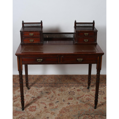 457 - AN EDWARDIAN MAHOGANY WRITING DESK the superstructure with four short drawers with pierced gallery a... 