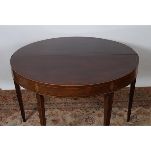 461 - A HEPPLEWHITE DESIGN MAHOGANY OCCASIONAL TABLE of oval outline the shaped top above a carved and mou... 