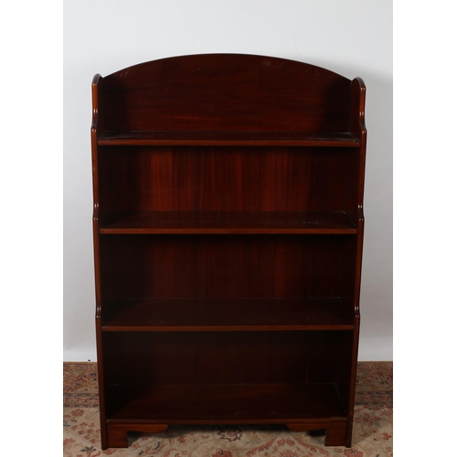 463 - A MAHOGANY OPEN FRONT BOOKSHELF the moulded back above four open shelves on bracket feet 
144cm (h) ... 