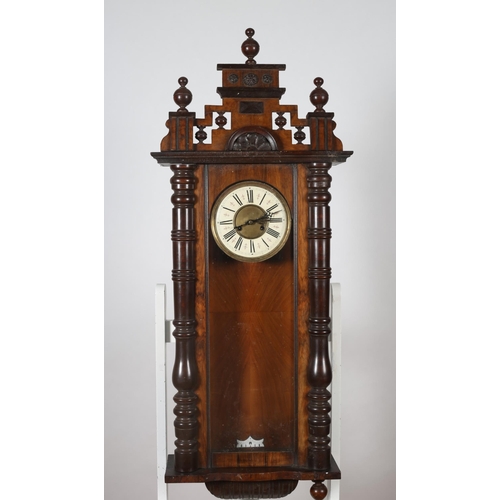 474 - A 19TH CENTURY MAHOGANY AND WALNUT VIENNA WALL CLOCK the superstructure with urn finials above a gla... 