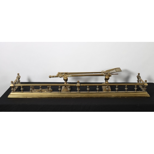 482 - A 19TH CENTURY BRASS FENDER the square top rail above a stepped platform joined by baluster stretche... 