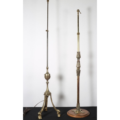 485 - A BRASS STANDARD LAMP the cylindrical and urn column on splayed legs with scroll toes 
122cm (h) 
to... 