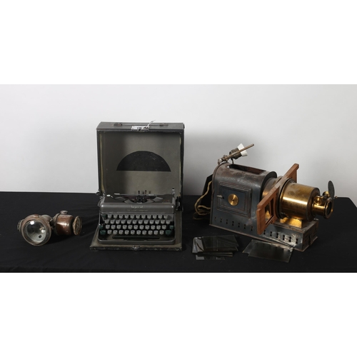 492 - A VINTAGE IMPERIAL PORTABLE TYPEWRITER, a 19th century brass and zinc projector with nine glazed sli... 