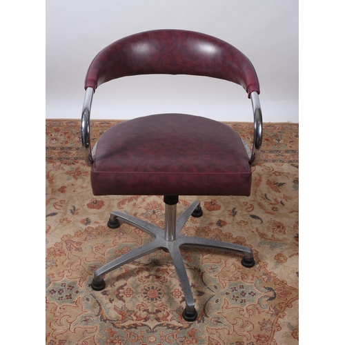 502 - A DESIGNER CHROME AND REXINE UPHOLSTERED TUB SHAPED SWIVEL OFFICE CHAIR the upholstered back and sea... 