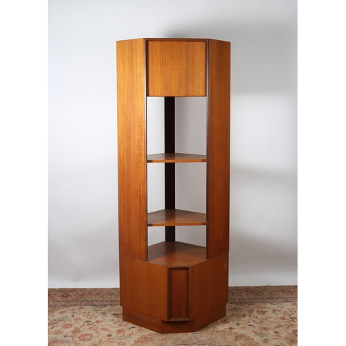 506 - A G-PLAN TEAK OPEN FRONT CORNER CABINET the moulded top above a panel door and three open shelves be... 