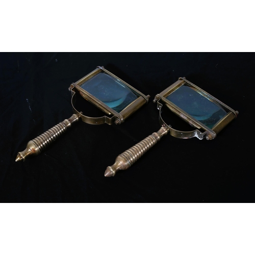 573 - A PAIR OF BRASS MAGNIFYING GLASSES each of rectangular form with turned handles